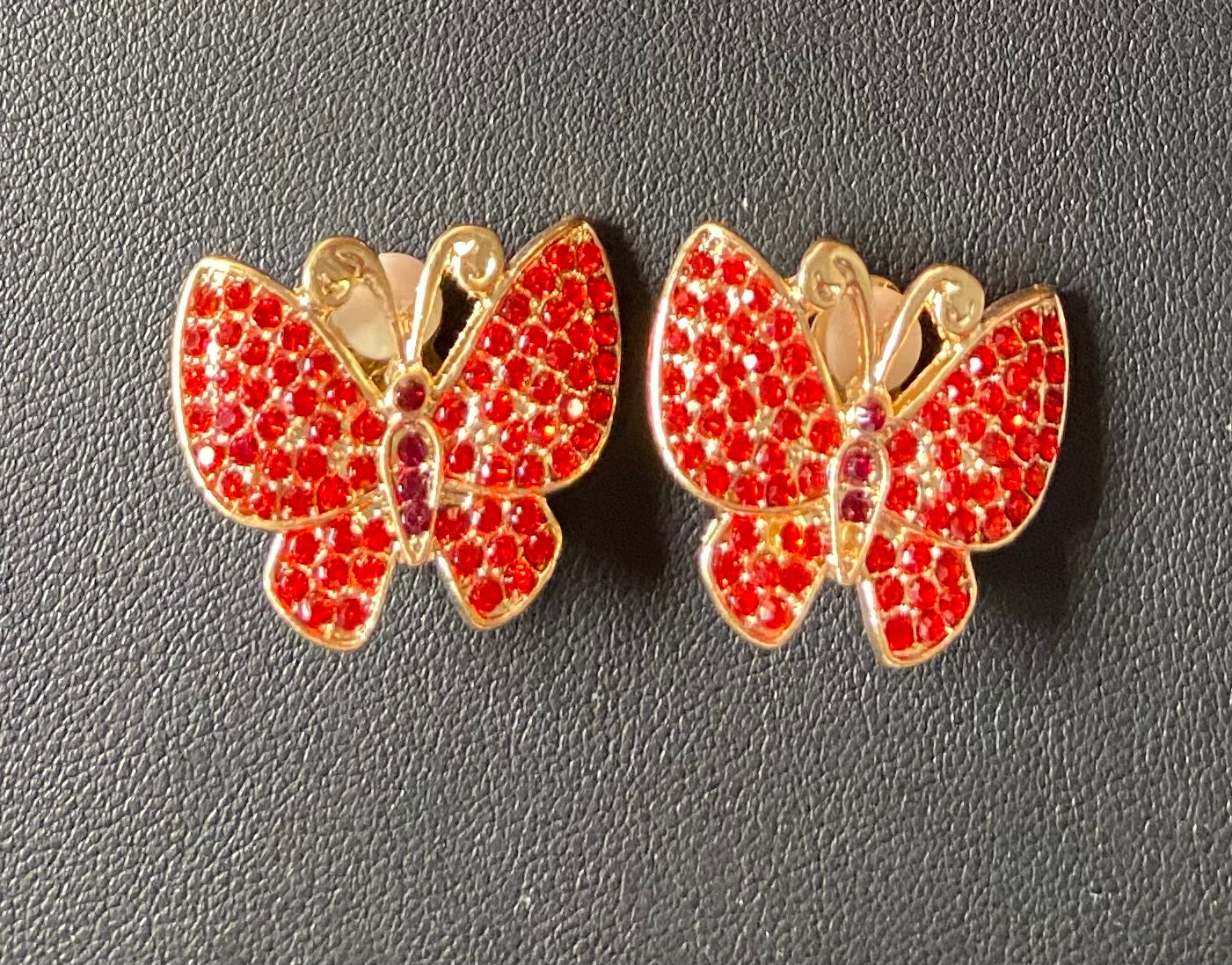 Gold red bling clip on butterfly earrings